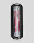 Two red FC Twente pens with silver tips in a black plastic pen case
