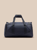 Midnight blue Castore holdall shown from the front with dual top handles and a front logo badge.