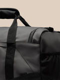 Close up of the padded handle and adjustable strap on the Core Holdall