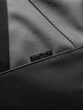 Close up of ProTek waterproof surface and stitching on the Core Holdall gunmetal bag