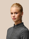 Close-up of Flow Training Fleece Half Zip Top in black, highlighting funnel collar and center front half zip.