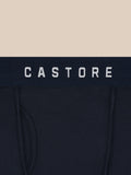 Close-up of navy boxer briefs with a Castore branded waistband.