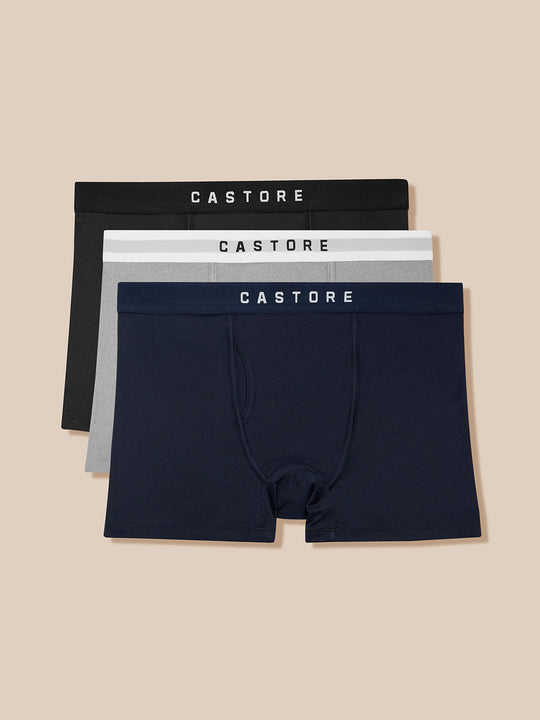 Three-pack Castore boxer briefs in black grey and navy with branded waistbands.
