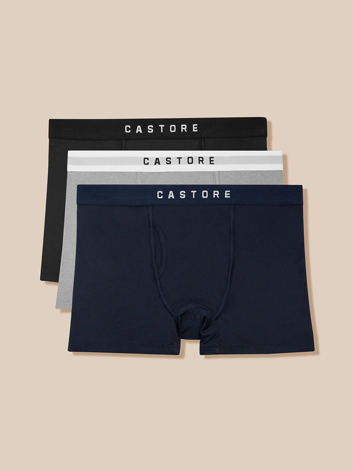 Three-pack Castore boxer briefs in black grey and navy with branded waistbands.