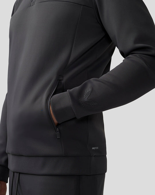 Side view of men's charcoal Scuba top showing a zip pocket and sleeve logo.