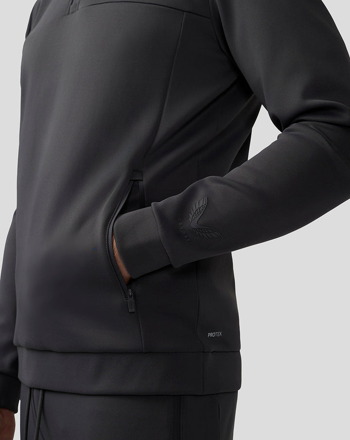 Side view of men's charcoal Scuba top showing a zip pocket and sleeve logo.
