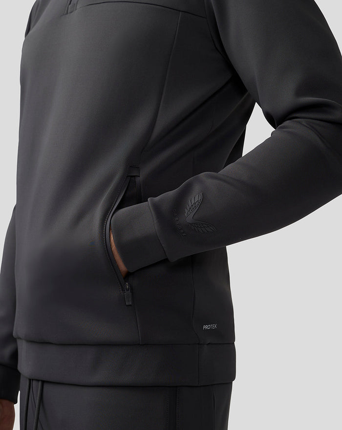 Side view of men's charcoal Scuba top showing a zip pocket and sleeve logo.