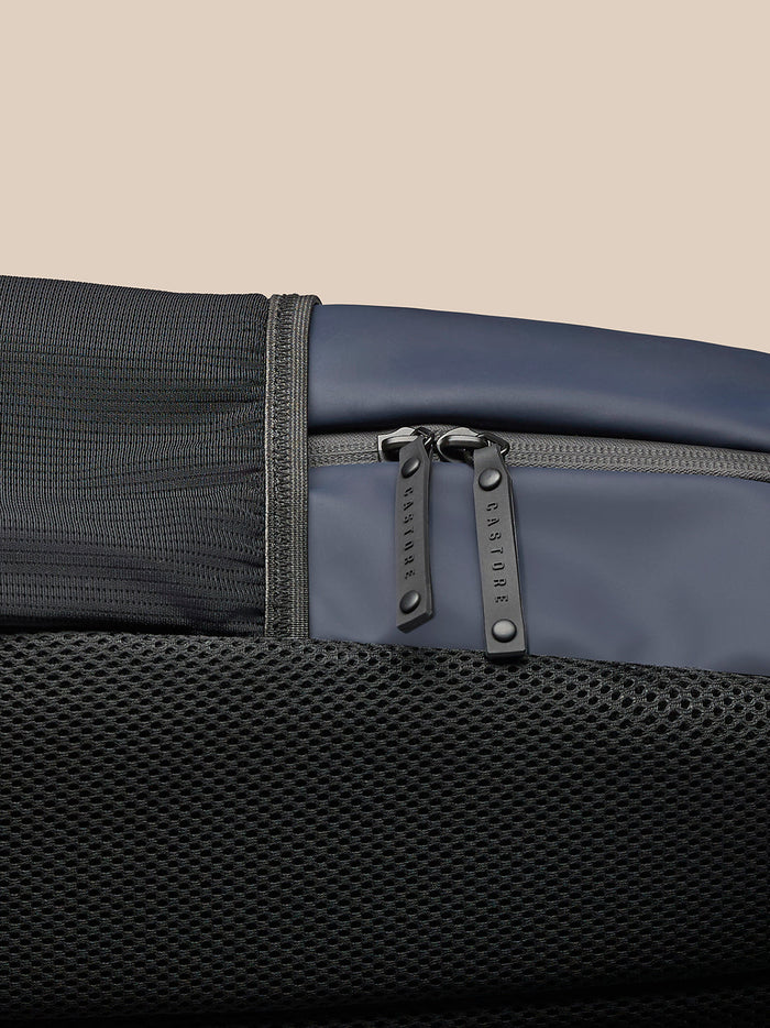 Close-up of navy Active Backpack highlighting padded back, mesh lower panel and grey zipper pulls