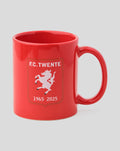 Red FC Twente jubileum mug with crest and handle, presented beside a red gift box.