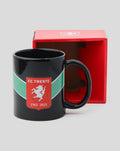 Black FC Twente Jubilee mug with crest on a green band and 1965 2025 years beside a red gift box