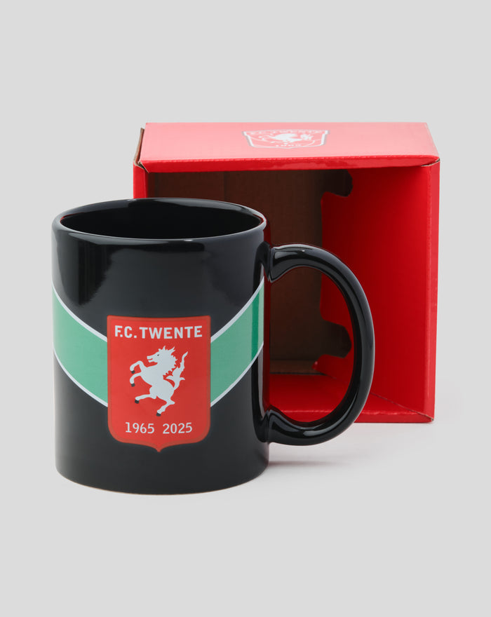 Black FC Twente Jubilee mug with crest on a green band and 1965 2025 years beside a red gift box