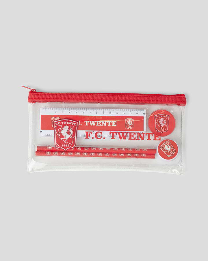 Clear zip pouch showing FC Twente ruler pencils and round badges inside.