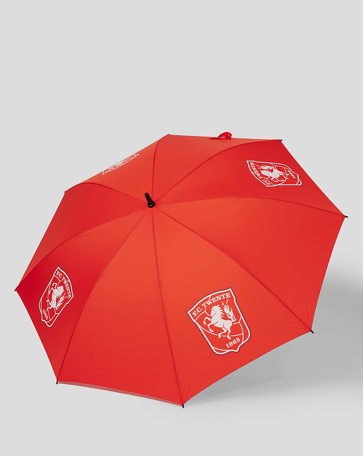 Red FC Twente golf umbrella with white crest logos on the canopy.