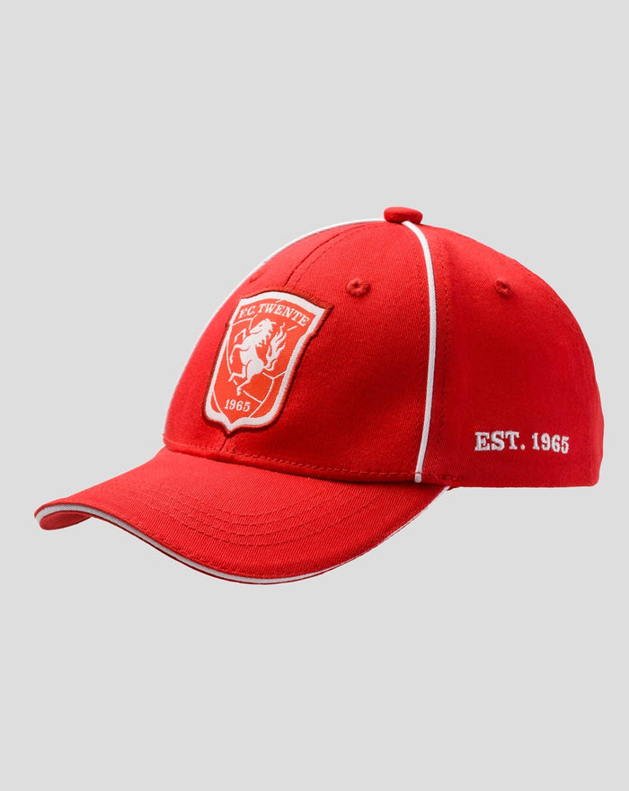 Red FC Twente junior cap shown from the side with crest patch on the front and EST 1965 embroidery on the side