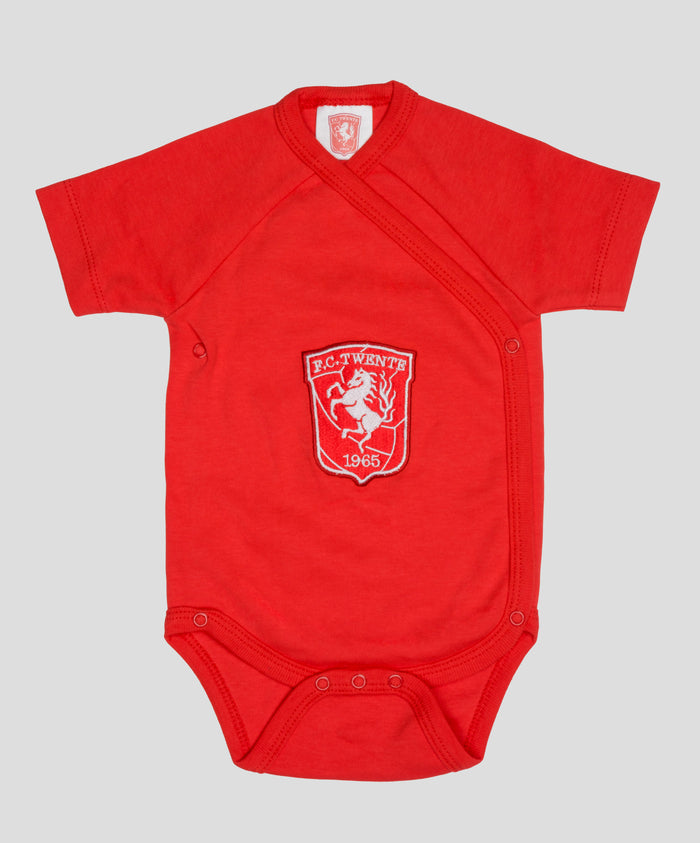 Front view of red FC Twente romper with crest patch on chest