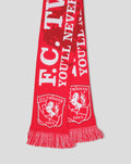 Red FC Twente scarf with bold white lettering and crest motifs, fringed ends.