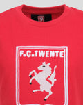 Close-up of red FC Twente Heritage T-shirt neckline with inside tag and partial chest logo visible