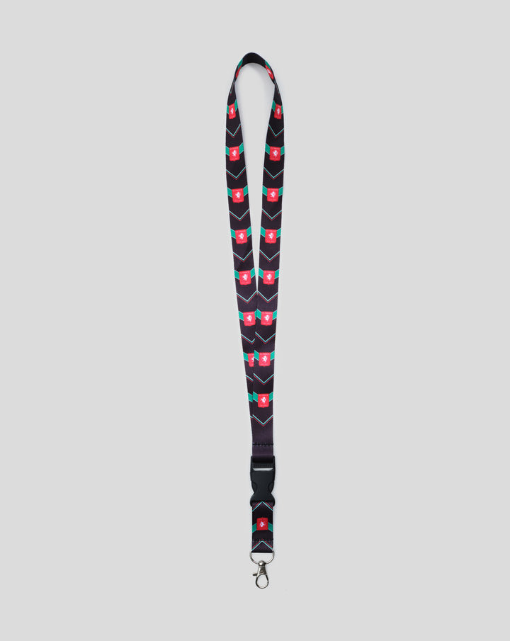 FC Twente jubileum sleutelkoord with dark navy strap, red crest motifs and teal chevrons, metal clasp