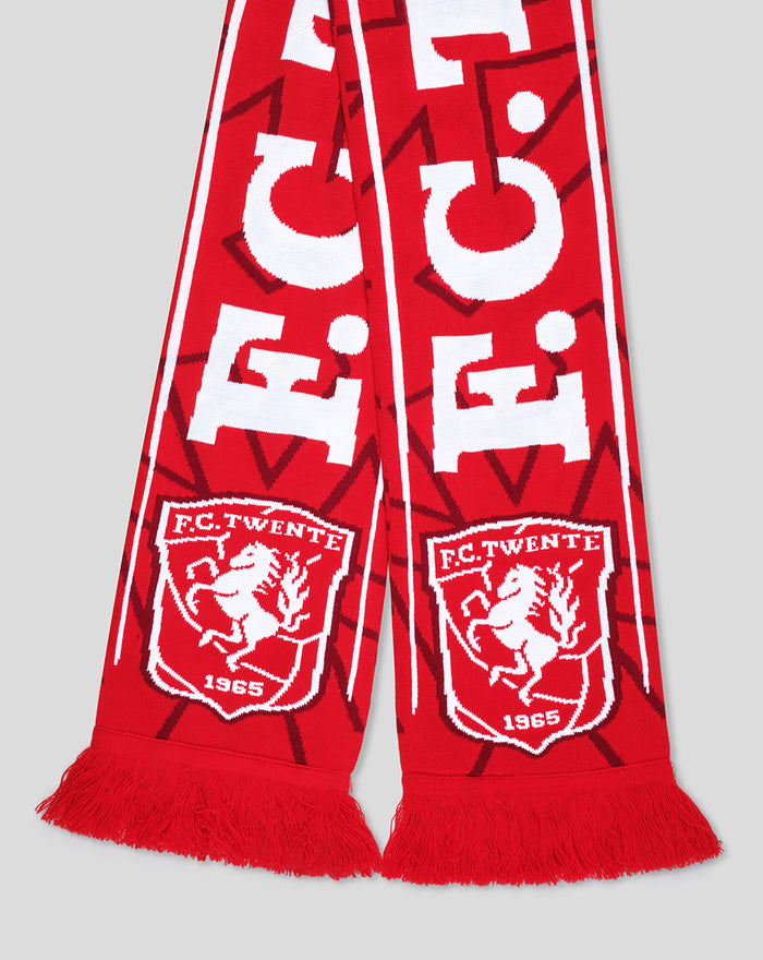 Close up of FC Twente home scarf showing crest and red fringe along the ends.