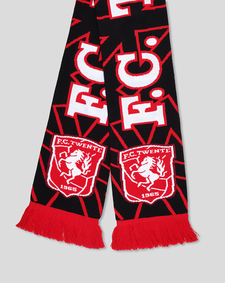 Close up of FC Twente Away scarf showing crest patches and red fringe along the ends.