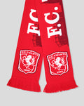 Close up of red FC Twente Skyline scarf end with white crest and fringe