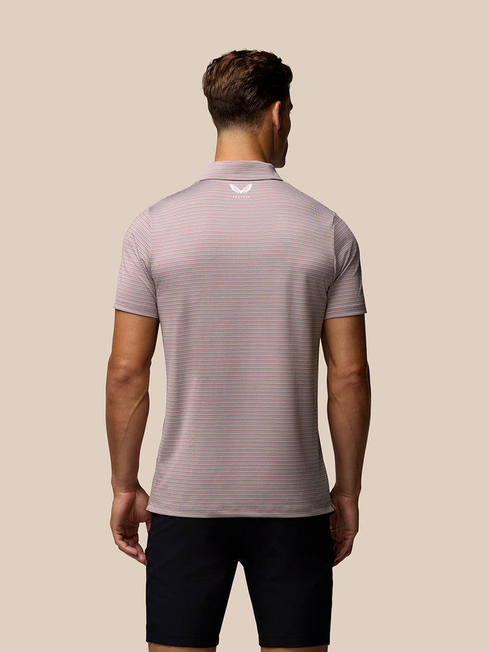 Back view of a pink yarn-dye striped golf polo with horizontal stripes and Castore logo on the upper back