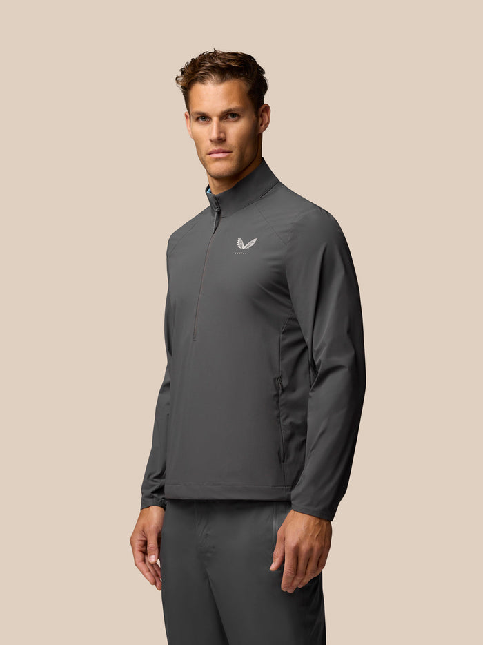 Heren Golf Lange Mouw Flex Gewoven Top Gunmetal met opstaande kraag en halve ritssluiting; Castore-logo op borst en mouw.