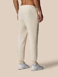 Back view of oatmeal fleece joggers with zip side pocket and ribbed cuffs