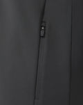 Close up of a zip pocket on dark gunmetal Castore sweatshirt fabric.
