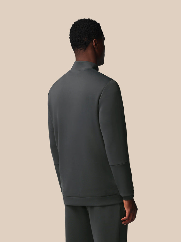 Achteraanzicht van man in donkergrijs Heren Flex Sweatshirt met kwart-rits.