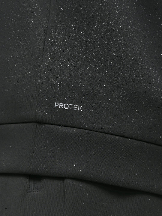 Close-up of black ProTek fabric with water droplets and ProTek branding on the sleeve