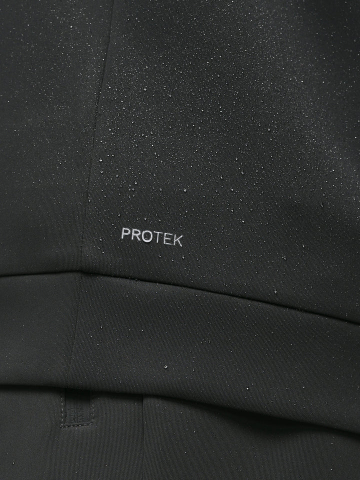 Close-up of black ProTek fabric with water droplets and ProTek branding on the sleeve