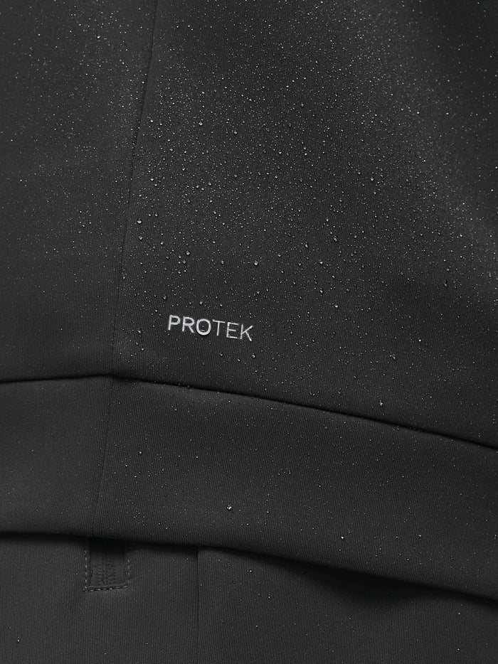 Close-up of black ProTek fabric with water droplets and ProTek branding on the sleeve