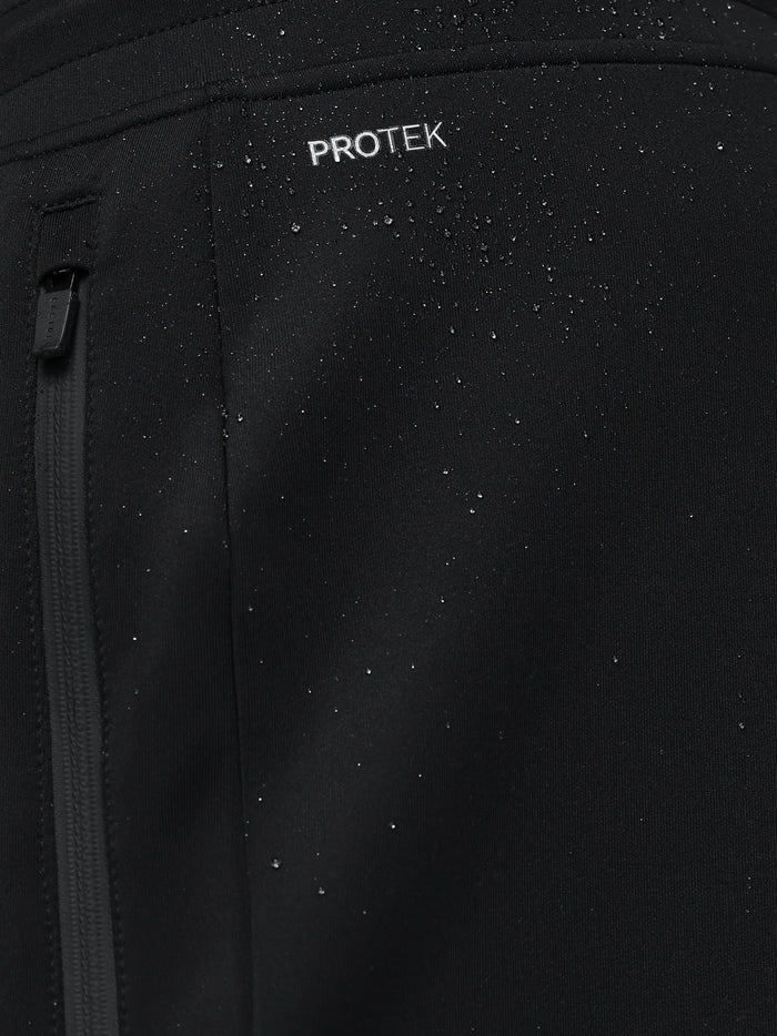 Close-up of black fabric with water droplets and ProTek branding highlighting rain resistance and zipper detail