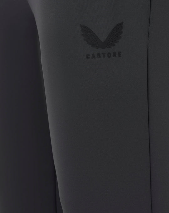 Close up of dark fabric with embossed Castore logo on the joggers