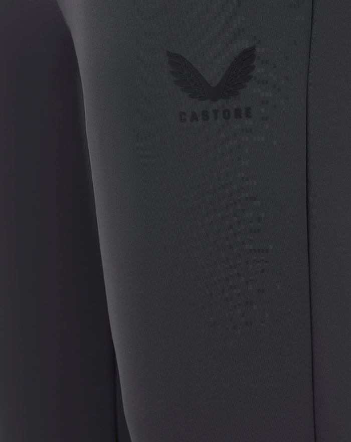 Close up of dark fabric with embossed Castore logo on the joggers