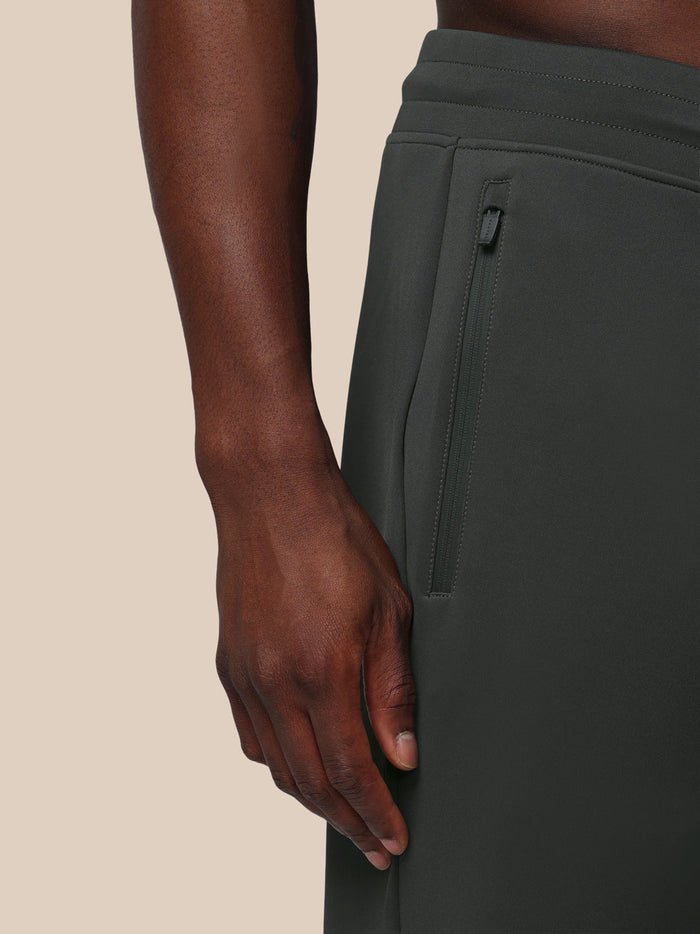 Close up of zippered side pocket on men's gunmetal Flex Joggers showing durable zipper and alignment