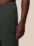 Close up of zipped side pocket on dark joggers with Castore logo on the thigh