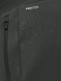 Close up of ProTek label on Gunmetal Heren Flex Joggers fabric showing waterproof detail and a zip pocket.