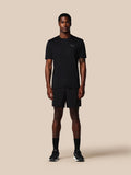 Full-body front view of a male model in black Adapt Training Shorts and matching top