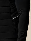 Close up of black Apex Gilet lower side showing reflective stripe and textured fabric