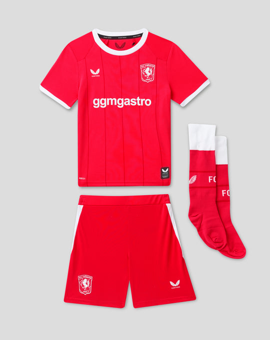 Kids FC Twente 26/27 home kit featuring a red shirt with crest and sponsor, paired with red shorts and white socks.