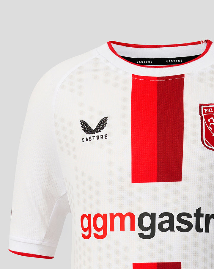 Close up of FC Twente Derde Shirt 26/27 Junior white jersey with bold red central stripe, Castore logo and club crest.