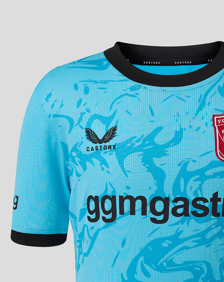 Junior blue FC Twente goalkeeper shirt with turquoise abstract print and team crest on the chest