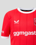 Front view of FC Twente home shirt with crest on the right chest and Castore logo on the left plus bold sponsor text across