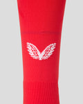 Detail view of red FC Twente home sock showing white knit branding near the ankle and toe area