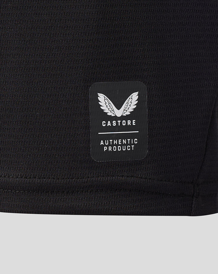 Castore authentic product badge on black fabric of FC Twente 26/27 Junior away shirt.