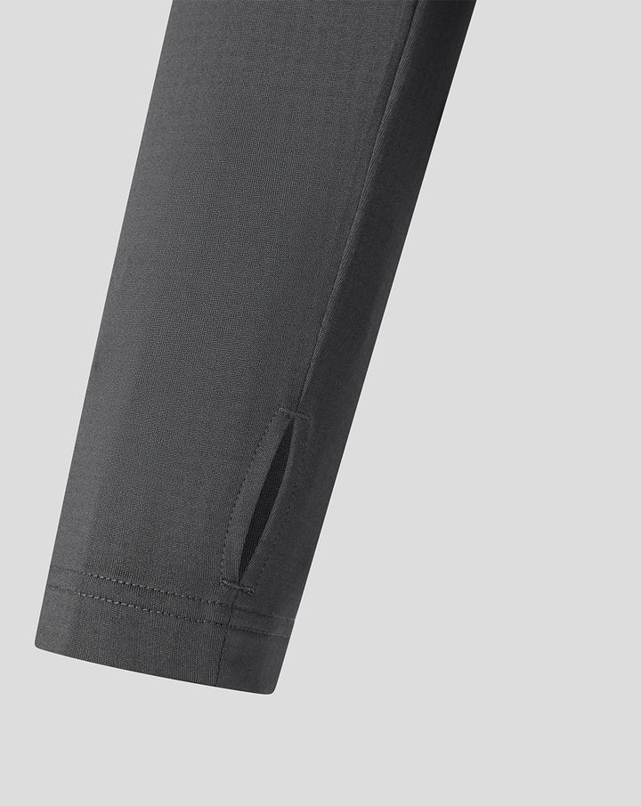 Close-up of the sleeve cuff on the FC Twente midlayer top showing stitching and a small zip pocket detail