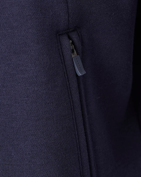 Zippered pocket detail on a navy FC Twente Travel fleece sweater for men.