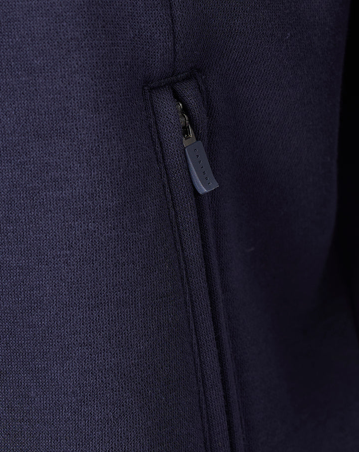 Zippered pocket detail on a navy FC Twente Travel fleece sweater for men.